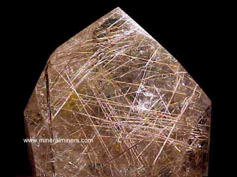 Rutilated Quartz Crystal link - click to see images of polished quartz crystals with rutile inside
